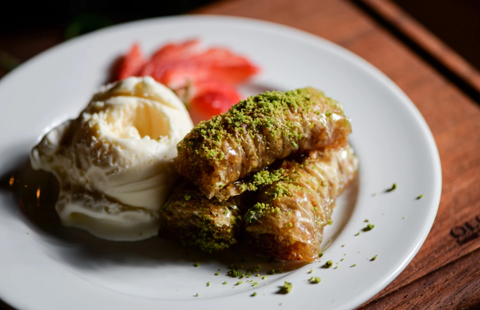 Baklava with ice cream, garnished with strawberries